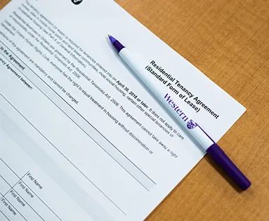 Pen on top of a rental agreement
