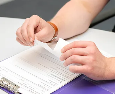 Person ripping up an agreement